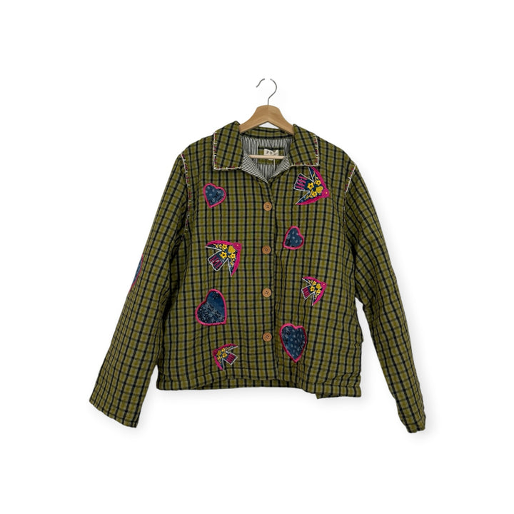 Birch Island Collective olive green and black plaid quilted jacket with heart and bird embroidery and button front.