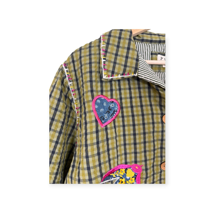 Birch Island Collective olive green and black plaid quilted jacket with heart and bird appliqués and contrast stitching